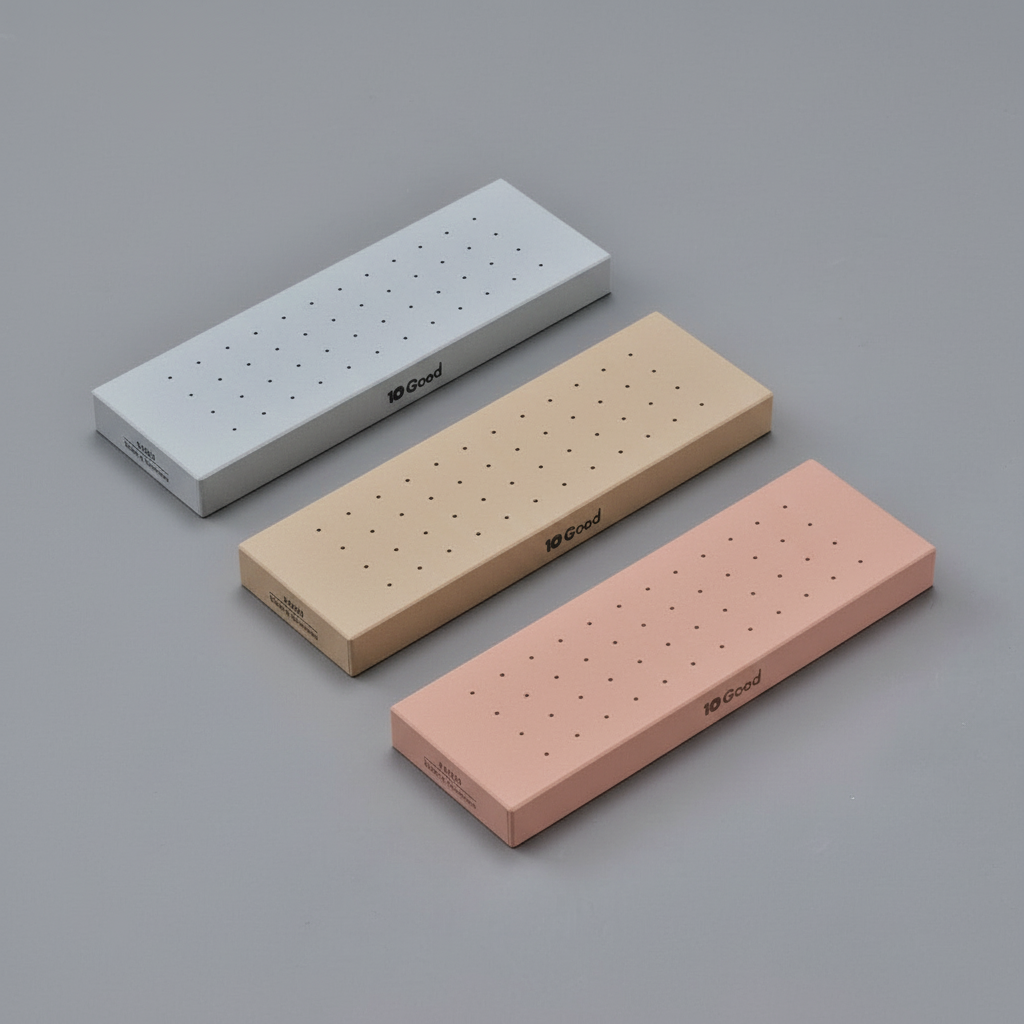 Three sharpening stones - blueish grey, beige, and pink